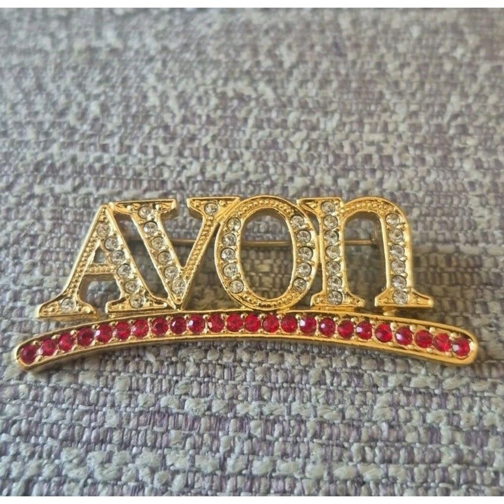 Avon Rhinestone Logo brooch Gold Tone Vintage Pin
